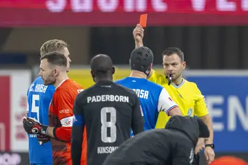 Referee Wolfgang Haslberger shows Rostock goalkeeper, Markus Kolke, the red card