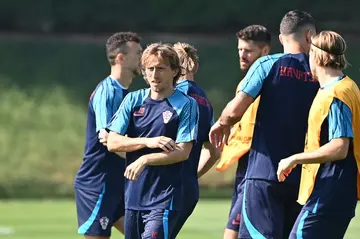 Luka Modric (L) has won 155 caps for Croatia since his debut in March 2006