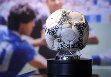 The match ball used in the 1986 FIFA World Cup Quarter-Final football match between Argentina and England, played at the Estadio Azteca, Mexico City, is pictured during a photocall ahead of its auction.