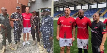 John Terry poses with Nigerian police officers in Lagos.