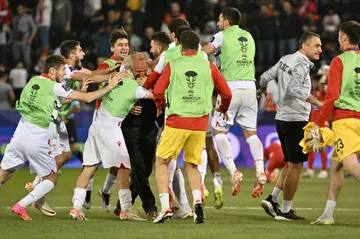 Segrt and his Tajik players celebrate after the win over Lebanon