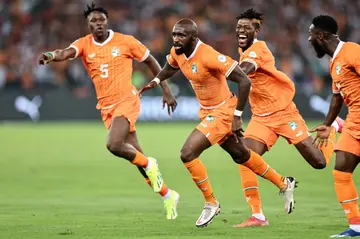 Seko Fofana runs away in celebration after scoring the opening goal of the Africa Cup of Nations for hosts Ivory Coast