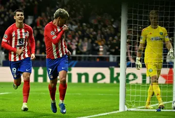 Atletico Madrid's French forward Antoine Griezmann celebrates scoring in the rout of Celtic which sent his team top of the group