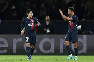 Warren Zaire-Emery (R) celebrates with Lee Kang-in after setting up the Korean star's goal