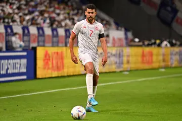 Who is Tunisia's national football team captain?