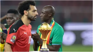 Mohamed Salah walks past the AFCON trophy after losing the final at Stade d'Olembe. Photo by Kenzo Tribouillard. 