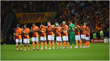 Galatasaray players observe a moment of silence during the opening ceremony before their UEFA Champions League match against F.C. Copenhagen. Photo by Seskim.