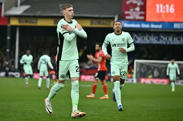 Chelsea's Cole Palmer (L) celebrates after scoring against Luton