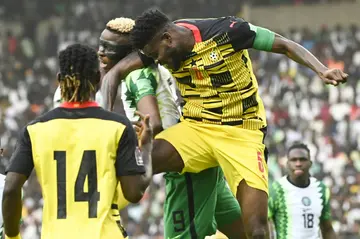 Nigeria star Victor Osimhen (2L) in an aerial clash during a 2022 World Cup qualifier against Ghana in Abuja.