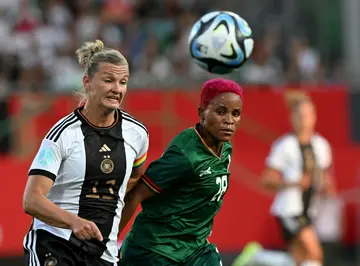 Germany's forward Alexandra Popp (L) and Zambia's Susan Banda battle for the ball during a recent friendly