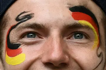 A Germany's fan cheers for his team at Wembley