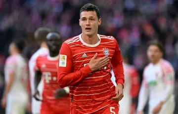 Bayern Munich defender Benjamin Pavard tapped his badge after scoring a goal against Augsburg in his team's 5-3 win
