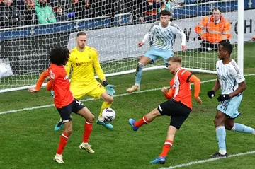 Luton's Luke Berry (C) shoots to equalise against Nottingham Forest