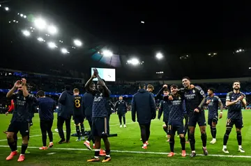 Real Madrid players celebrate at the end of the Champions League quarter-final second-leg penalty win over Man City