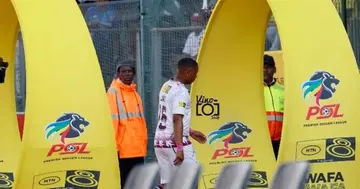 Andile Jali walking down the tunnel after being sent off.