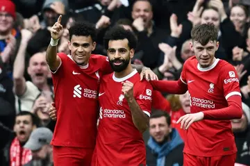 Liverpool's Mohamed Salah (C) celebrates after against Brighton