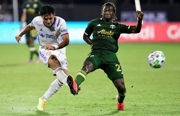 Japanese striker Yuya Kubo, left, of FC Cincinnati -- shown shooting past Portland's Diego Chara -- scored the go-ahead goal in his club's 4-2 victory over New York City in the Leagues Cup