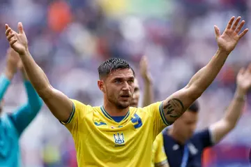 Roman Yaremchuk hails the supporters after securing an emotional win for war-torn Ukraine