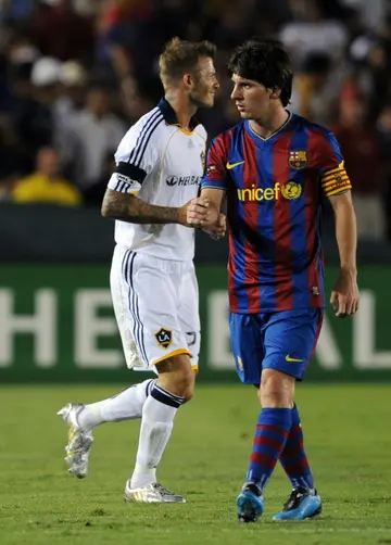 Lionel Messi in action for Barcelona against David Beckham of LA Galaxy in a friendly match in 2009