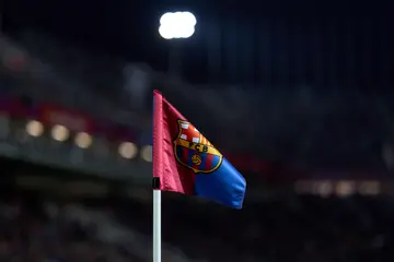 The FC Barcelona crest is seen on a corner flag during the La Liga EA Sports match against CA Osasuna at Estadi Olimpic Lluis Companys on January 31, 2024