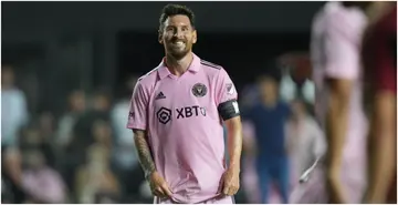 Lionel Messi smiles at a teammate during the Leagues Cup match between Atlanta United and Inter Miami at DRV PNK Stadium. Photo by Peter Joneleit.