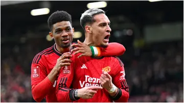 Antony celebrates with Amad Diallo after scoring during the Emirates FA Cup Quarter Final between Manchester United and Liverpool FC at Old Trafford. Photo by Michael Regan.