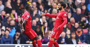 Sadio Mane with Mohamed Salah after scoring their side's first goal during the Premier League match between Watford and Liverpool at Vicarage Road on October 16, 2021 in Watford, England. (Photo by Richard Heathcote/Getty Images)