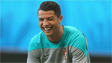 Cristiano Ronaldo laughs during the Portugal training session ahead of the 2014 FIFA World Cup. Photo by Martin Rose.