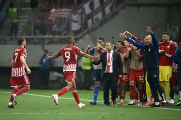 Olympiakos forward Ayoub El Kaabi (2L) celebrates after scoring against Aston Villa