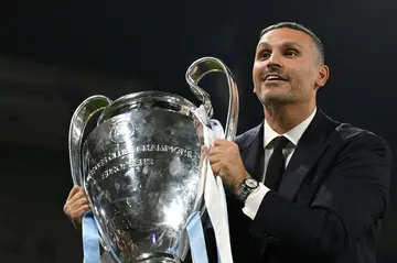 Manchester City chairman Khaldoon Al Mubarak poses with the Champions League trophy