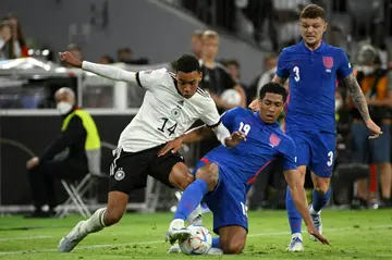 Jamal Musiala (L) and Jude Bellingham (C) faced each other in Germany's recent Nations League game against England
