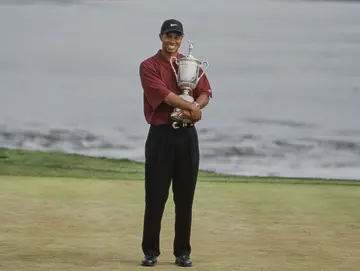 Tiger Woods holds the United States Golf Association Open Championship trophy