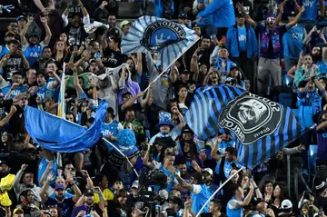 Charlotte FC fans celebrate a win over Inter Miami CF at Bank of America Stadium on October 21, 2023 in Charlotte, North Carolina.   Matt Kelley/Getty Images/AFP