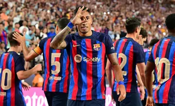 Barcelona's Raphinha gestures after scoring a goal in a friendly match against Real Madrid at Allegiant Stadium in Las Vegas, Nevada