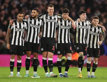 Players of Newcastle United line up