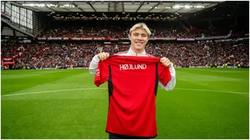 Rasmus Hojlund walks out to greet the fans ahead of the pre-season friendly match between Manchester United and RC Lens at Old Trafford. Photo by Ash Donelon.