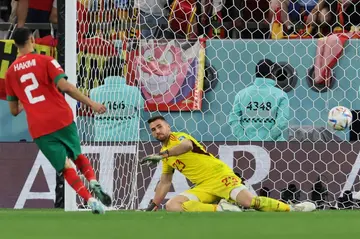 Achraf Hakimi chips home the winning penalty for Morocco