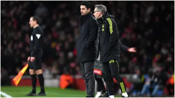 Albert Stuivenberg speaks with Mikel Arteta during the Emirates FA Cup Third Round match between Arsenal and Liverpool at Emirates Stadium. Photo by Stuart MacFarlane.