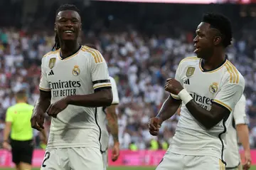 Real Madrid forward Vinicius Junior (R) celebrates with Eduardo Camavinga after scoring against Osasuna