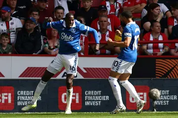 Abdoulaye Doucoure (L) and Arnaut Danjuma (R) celebrate during Everton's draw at Sheffield United