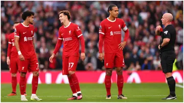 Referee Simon Hooper cancels his yellow card for Curtis Jones of Liverpool before upgrading the card to red during the Premier League match between Tottenham Hotspur and Liverpool FC. Photo by Marc Atkins.