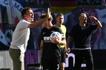 Augsburg's German head coach Enrico Maassen (L) spent just over a year at the Bavarian club