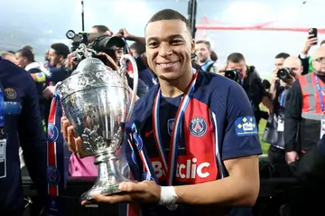 Kylian Mbappe celebrates with the French Cup trophy