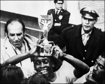 Pele celebrates his third World Cup crown in 1970