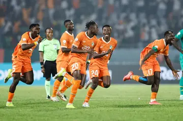 Ivory Coast players celebrate after winning the penalty shoot-out against Senegal to reach the last 16 of the Africa Cup of Nations