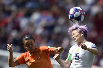 Sherida Spitse (L) and Megan Rapinoe of the US  tussle for the ball in the 2019 final