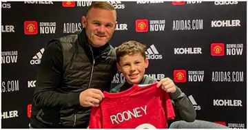 Wayne Rooney poses with his Son, Kai, after he signed for Man United's academy. Photo: @waynerooney.