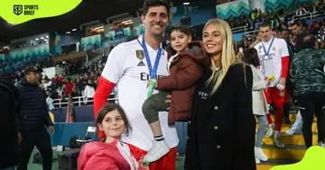 Thibaut Courtois and his wife, Mishel Gerzig, pose for a photo with their children.