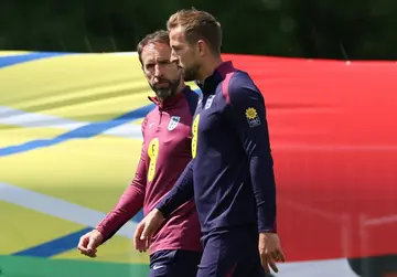 Harry Kane (right) has scored 59 of his 64 England goals under Gareth Southgate (left)