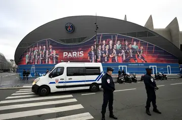 Police stand guard outside the Parc des Princes in Paris where Paris Saint-Germain will face Barcelona in the Champions League on Wednesday